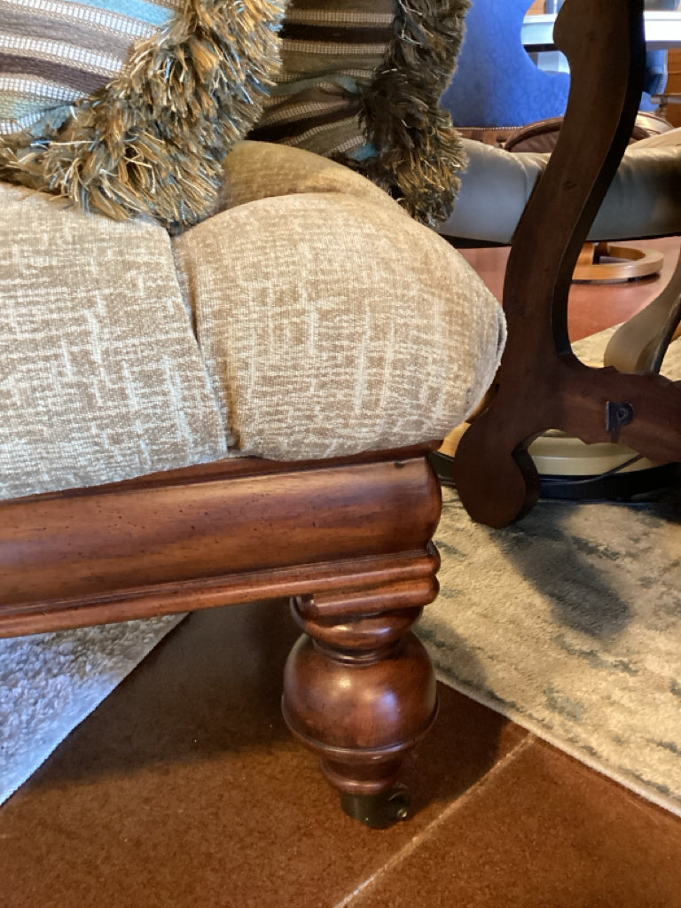 Ottoman|Elegant|Tufted Upholstered|Carved wood apron, turned legs, casters